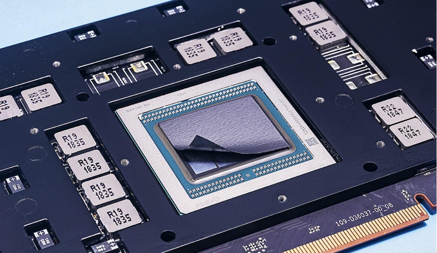 A sheet of TIMs being placed on a processing chip