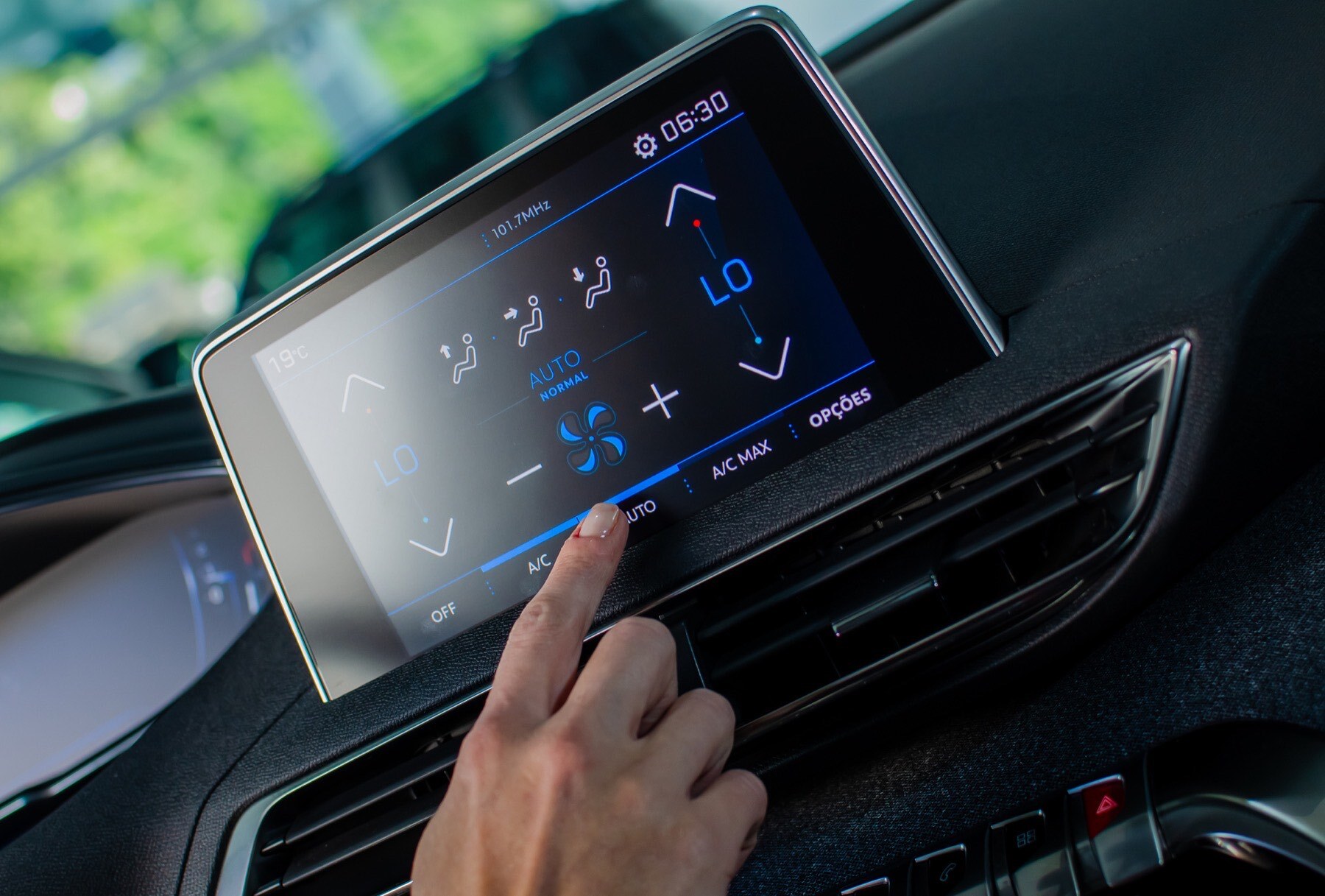 Finger pressing on a car touch screen display made with optical film
