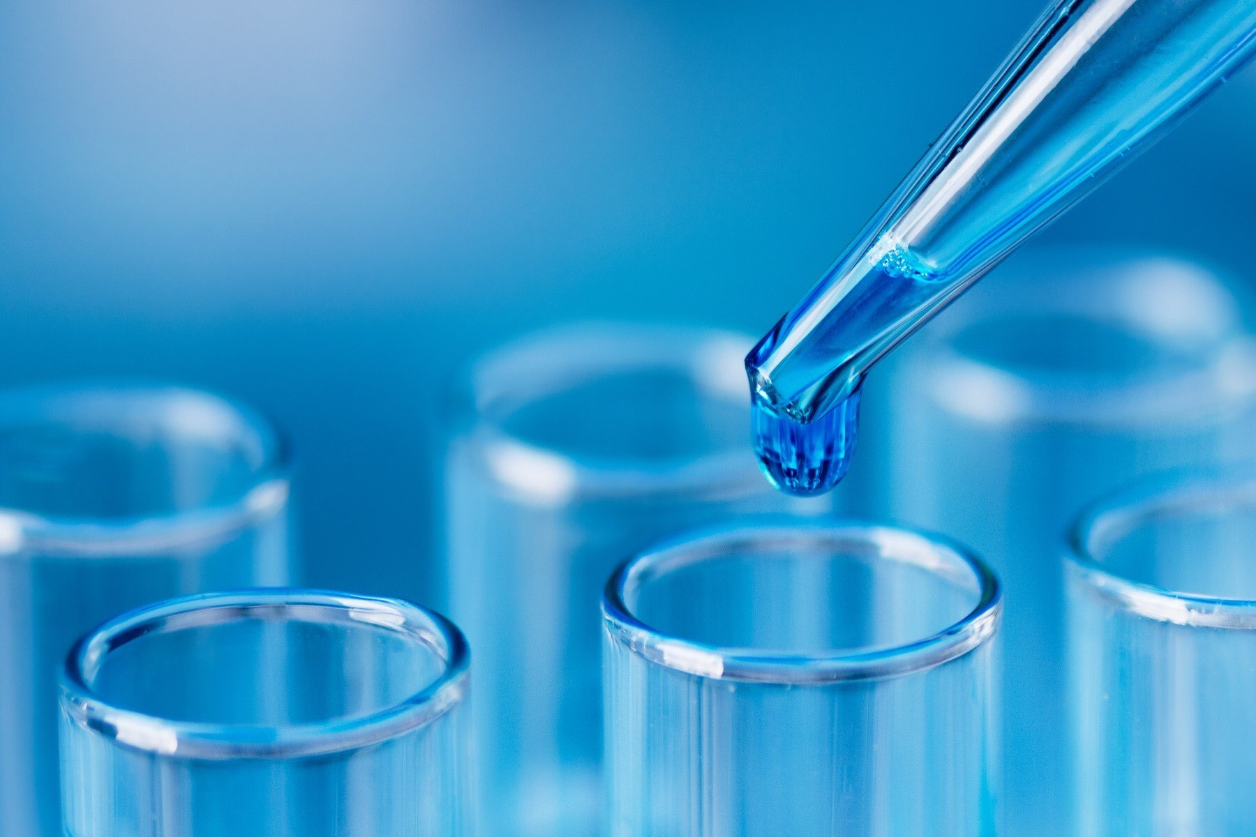 cop pipette droplet into test tube