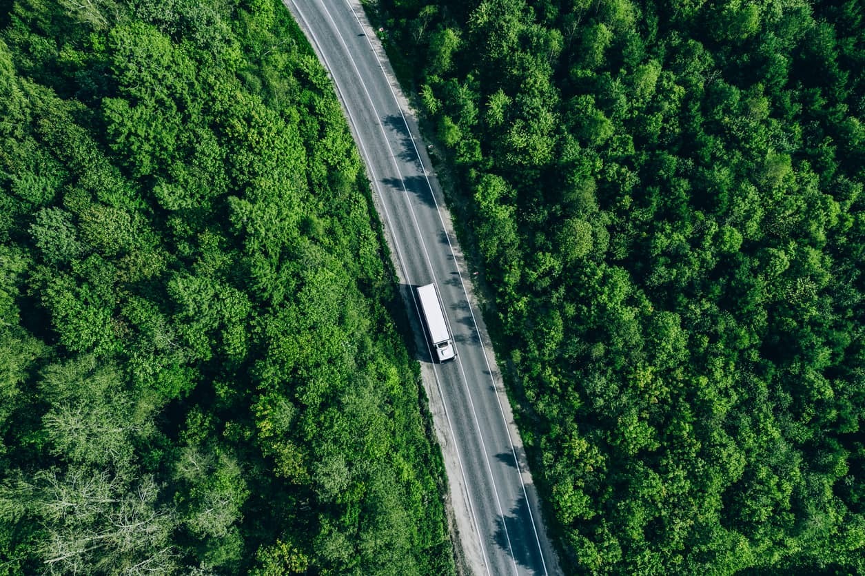 Aerial photo of a semi truck driving on a highway